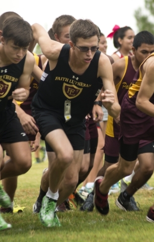 Chase Wood, of Faith Lutheran High School, starts his race during the Cross Country Division ...