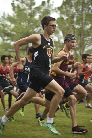 Chase Wood, of Faith Lutheran High School, starts his race during the Cross Country Division ...