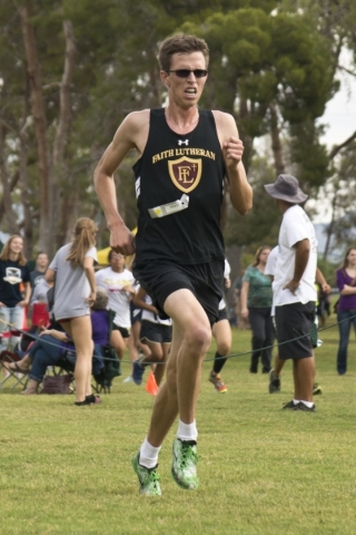 Chase Wood, of Faith Lutheran High School, pushes to beat his personal best during the Cross ...