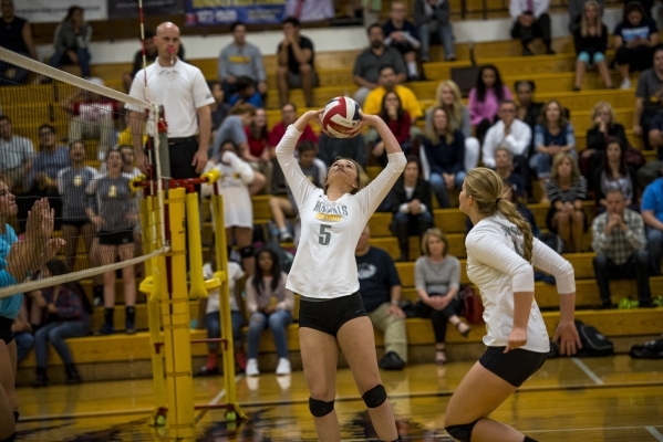 Hayley Huntsman of Bonanza puts the ball up into play during a volleyball match against Cent ...