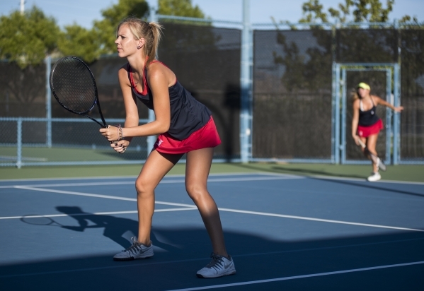 Twin sisters from left, Parker and Payton Burk from Liberty High School plays during their d ...