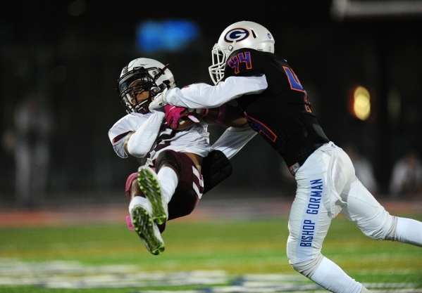 Bishop Gorman defensive back/wide receiver Brendan Radley-Hiles (44) smashes into Don Bosco ...