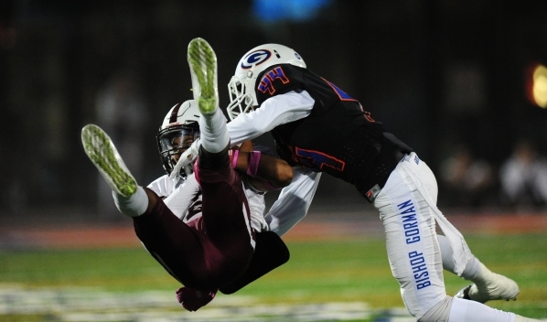 Bishop Gorman defensive back/wide receiver Brendan Radley-Hiles (44) smashes into Don Bosco ...