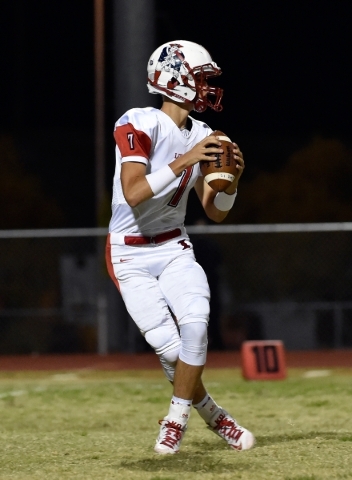 Liberty quarterback Kenyon Oblad looks to pass against Silverado during the first half of a ...