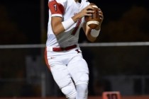 Liberty quarterback Kenyon Oblad looks to pass against Silverado during the first half of a ...