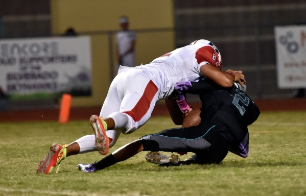 Silverado quarterback Christian Baltodano is sacked in the end zone for a safety by Liberty& ...