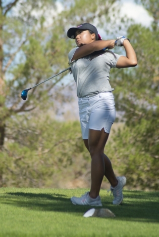 Sami Penor of Coronado High School hits her ball during the girls state championship golf to ...