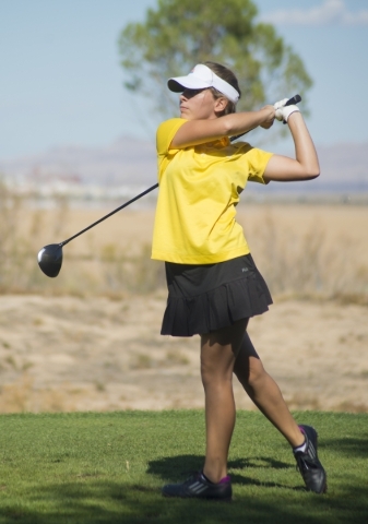 Rebecca Oertel of Bonanza High School hits her ball during the girls state championship golf ...