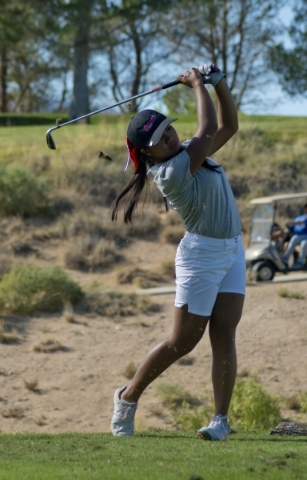 Sami Penor of Coronado High School hits her ball during the girls state championship golf to ...