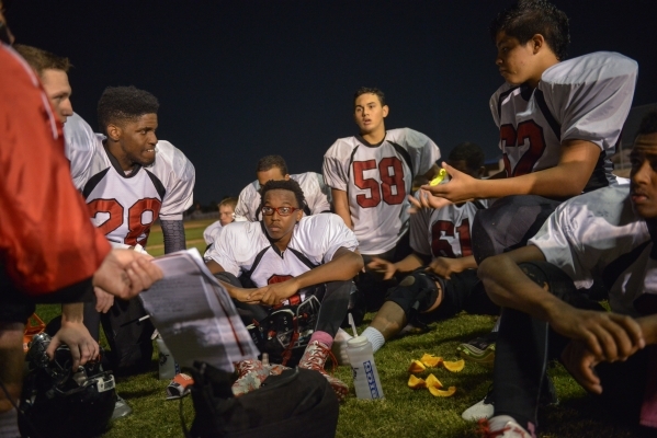 Mountain View Christian High School football players meet on the baseball field behind the f ...
