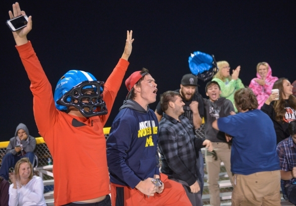 Mountain View Christian High School football fans celebrate a touchdown during their game ag ...
