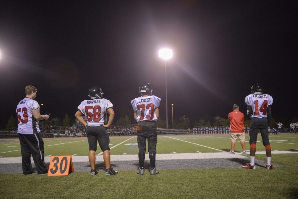 The Mountain View Christian High School football team substitutions wait on the sideline dur ...
