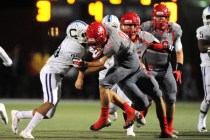 Arbor View running back Deago Stubbs runs into Centennial linebacker Joshua Campbell while r ...