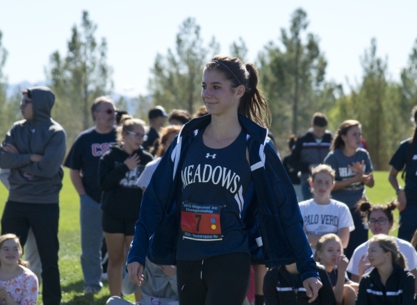 Ellen Hirsberg of The Meadows School accepts her first place medal after the girls Division ...