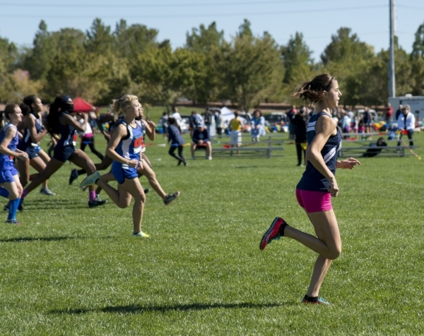 Ellen Hirsberg, in front, of The Meadows School pulls ahead at the start of the girls Divisi ...