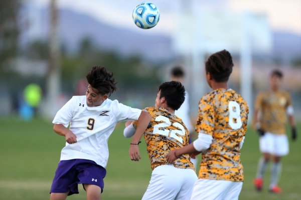 Durango&lsquo;s Jaime Munguia (9) fights for ball possession against Bonanza&lsquo;s Taichi ...