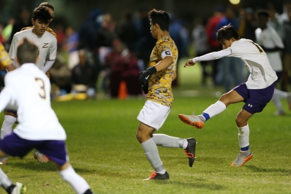 Durango&lsquo;s Christopher Bramasco (13) kicks the ball for a goal and to win the game in e ...