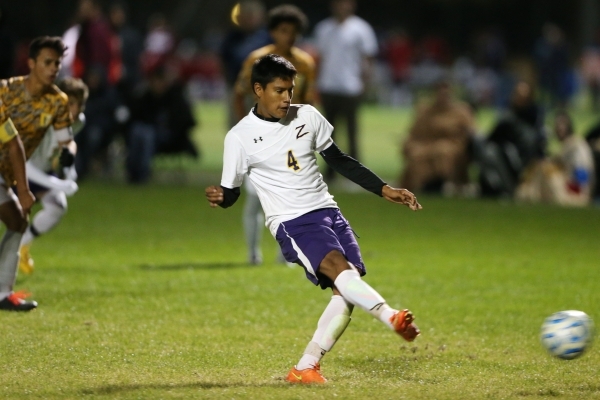 Durango&lsquo;s Marcos Delangel-Parra (4) kicks the ball for a goal against Bonanza in their ...