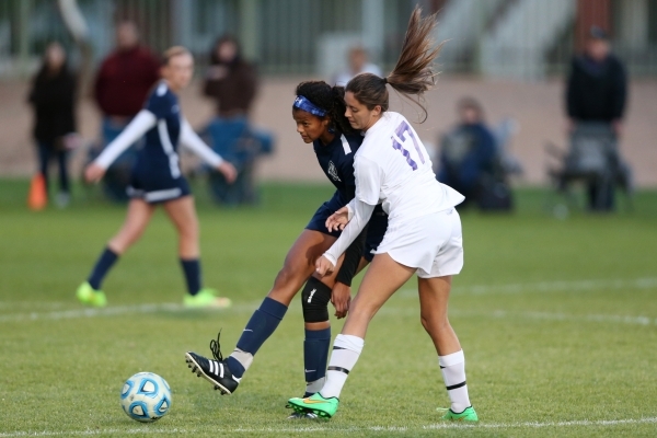 Foothill‘s Rae Burrell (12), left, makes a pass with pressure from Silverado‘s A ...