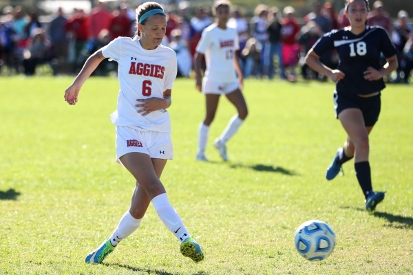 Arbor View‘s Marcella Brooks (6) kicks the ball for a goal against Centennial in their ...