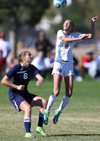Arbor View‘s Samantha Blanchard (6) leaps for the ball as Centennial‘s Marcella ...