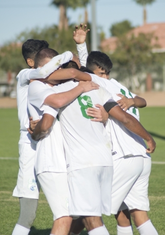 Green Valley‘s Ricardo Nunez (8) is congratulated by teammates after he scored a goal ...