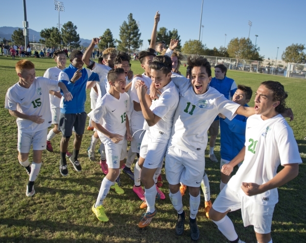 The Green Valley High School boys soccer team celebrates after winning the Sunrise Region bo ...
