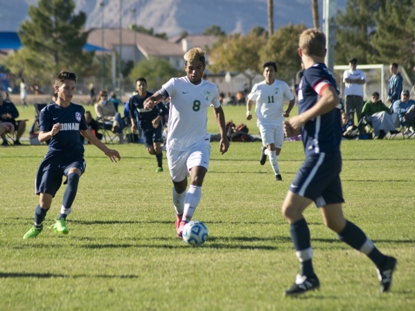 Green Valley‘s Ricardo Nunez (8) takes the ball up the field during the Sunrise Region ...