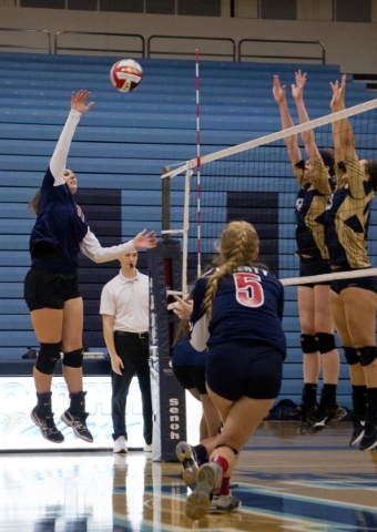 Liberty‘s Maggie Heim (11) hits the ball over the net during the Sunrise Region girls ...