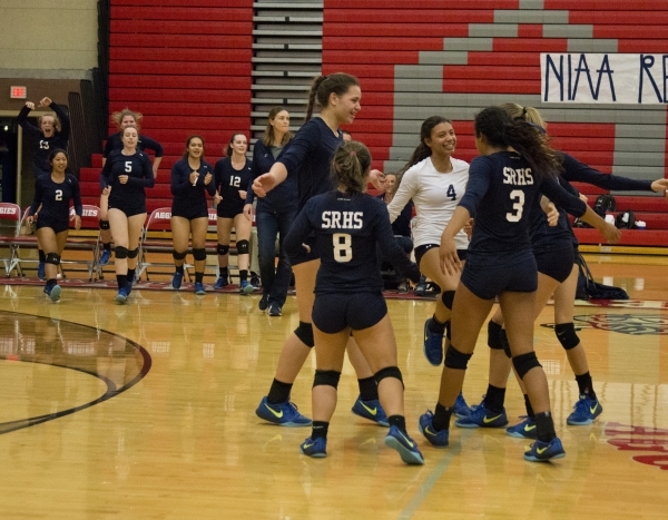 Shadow Ridge High School celebrates after winning the Sunset Region girls volleyball semifin ...