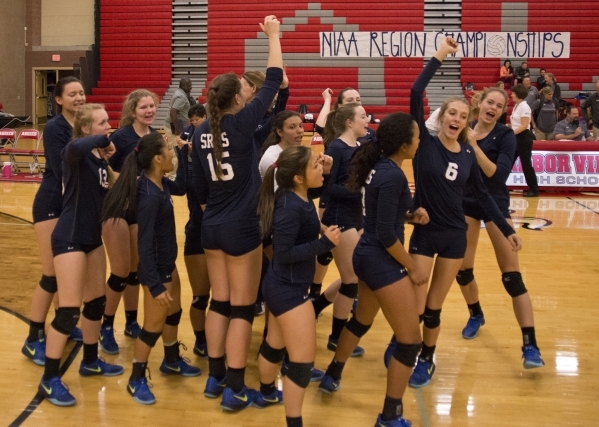 Shadow Ridge High School celebrates after winning the Sunset Region girls volleyball semifin ...