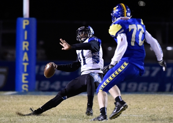 Desert Pines quarterback Marckell Grayson (11) looks to pass against Moapa Valley‘s La ...