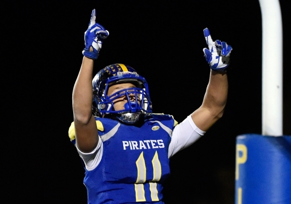 Moapa Valley‘s R.J. Hubert celebrates his touchdown during the fourth quarter against ...