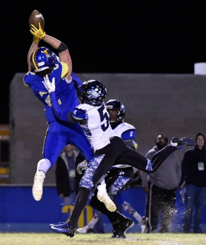Moapa Valley‘s Trystin Deal makes a catch against Desert Pines‘ Eddie Heckard (5 ...
