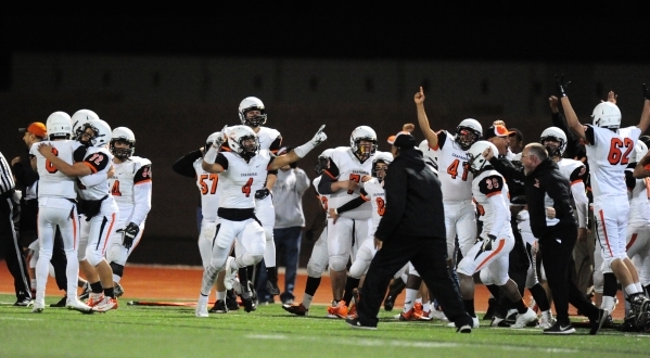The Chaparral sideline explodes with excitement after they upset Faith Lutheran 21-20 during ...