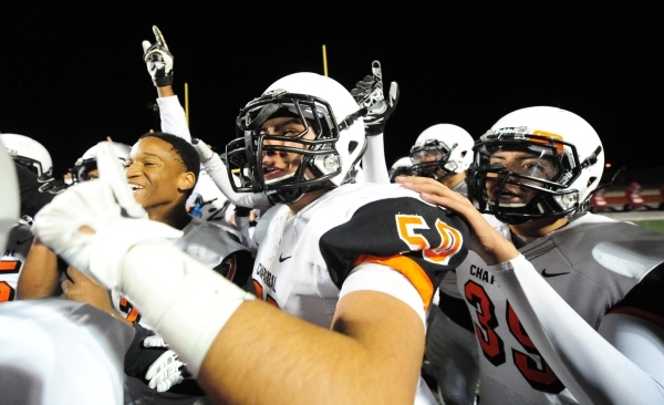 Chaparral players celebrate after they upset Faith Lutheran 21-20 in their I-A state quarter ...