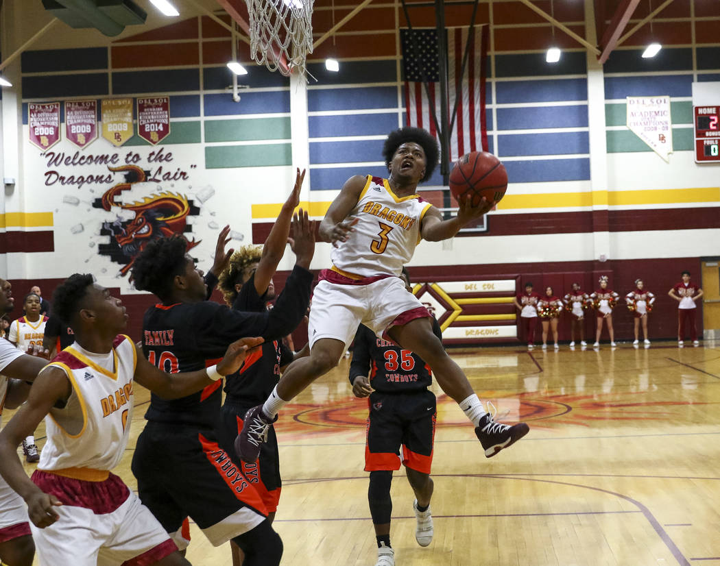 Del Sol point guard Antonio Simpson (3) goes up for a shot against Chaparral during a varsit ...