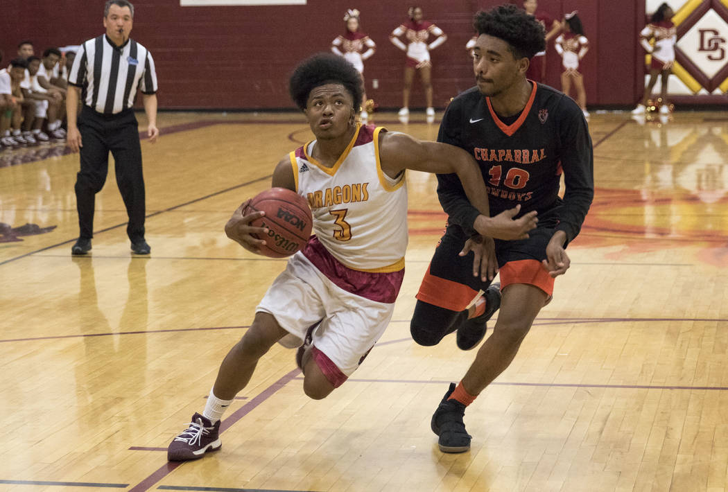 Del Sol point guard Antonio Simpson (3) goes up for a shot against Chaparral’s Cairyn ...