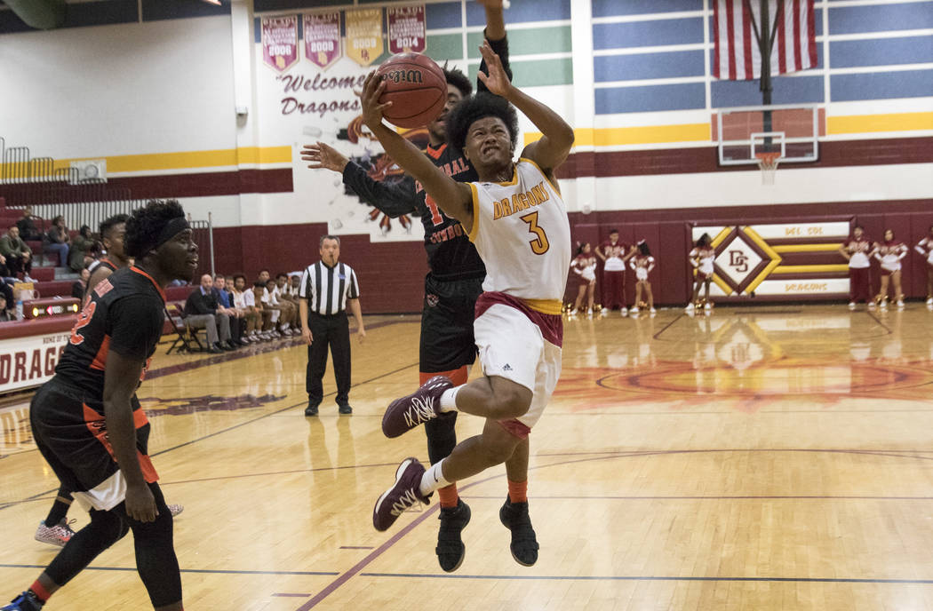 Del Sol point guard Antonio Simpson (3) goes up for a shot against Chaparral’s Cairyn ...