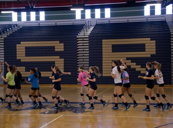 Players on the Shadow Ridge girls volleyball run laps during practice at Shadow Ridge High S ...