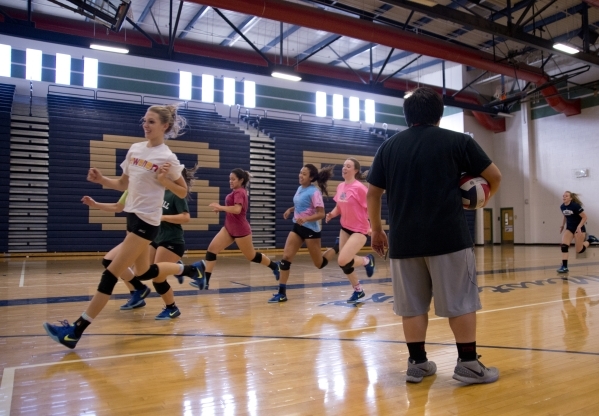 Players on the Shadow Ridge girls volleyball run laps during practice at Shadow Ridge High S ...