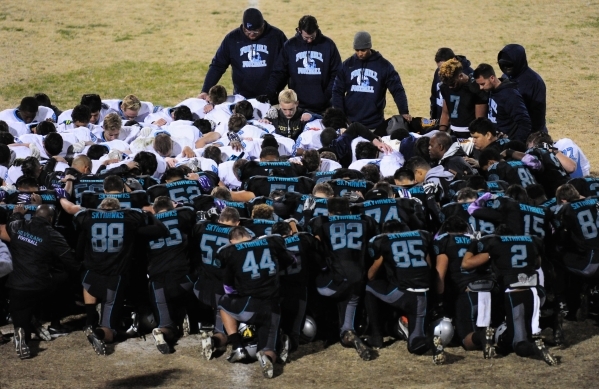 Foothill and Silverado players meet at midfield in support of junior defensive tackle Ian Mc ...