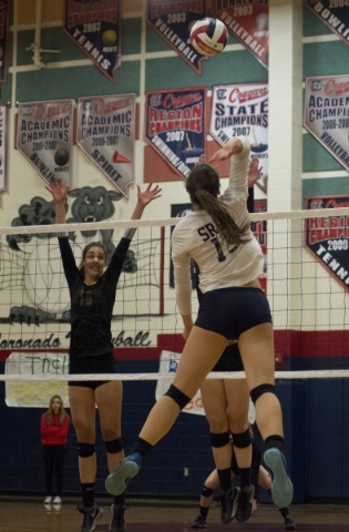 Shadow Ridge‘s Whittnee Nihipali (15) hits the ball during the Division I state semifi ...