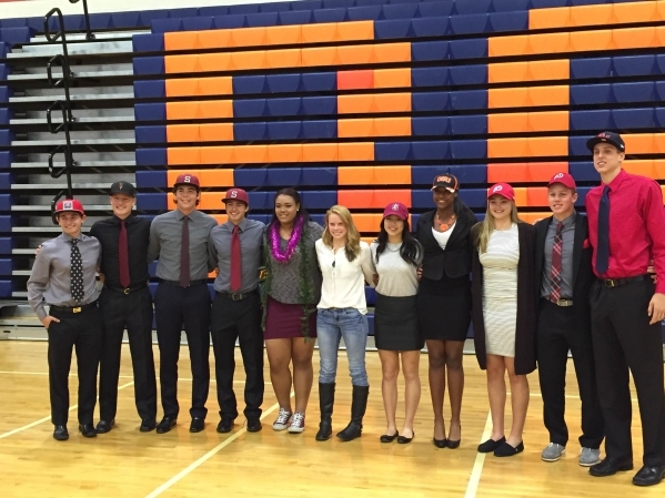 All 11 Bishop Gorman student-athletes pose after signing their National Letters of Intent on ...