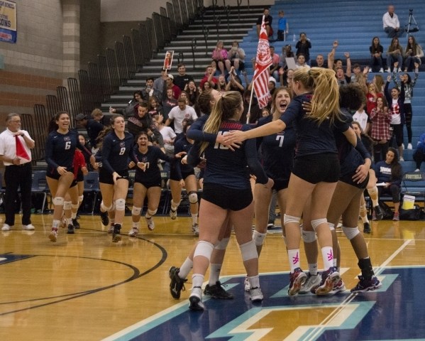 Coronado celebrates after winning the division I state volleyball final match between Corona ...
