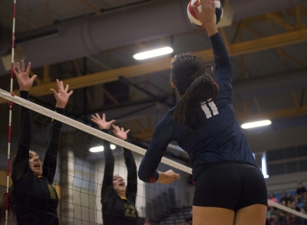 Coronado‘s Carolyn Andrulis (11) hits the ball during the division I state volleyball ...