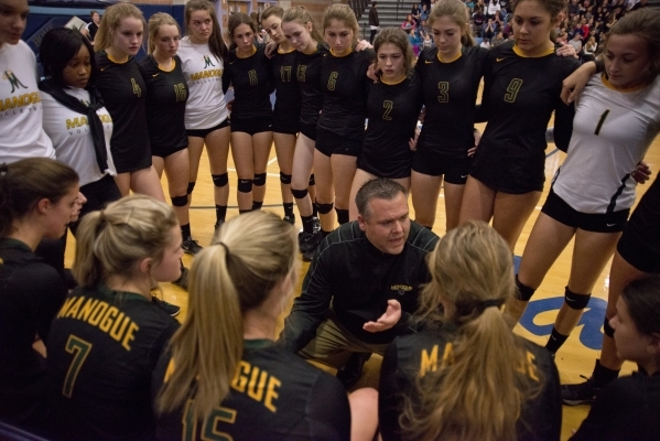 Bishop Manogue‘s coach Jason Sterrett talks to his team during the division I state vo ...