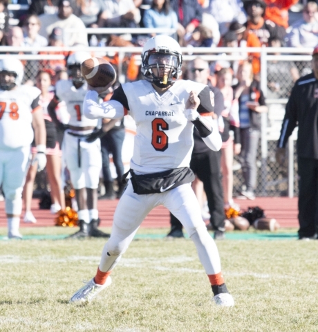 Chaparral quarterback Andrew Solis prepares to throw against the Greenwave defense in the fi ...