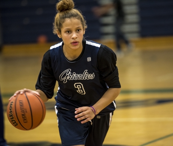 Essence Booker runs with the ball during basketball practice at Spring Valley High School in ...