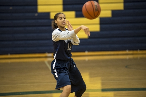 Kayla Harris passes the ball during basketball practice at Spring Valley High School in Las ...